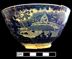 Pearlware London shape bowl printed underglaze in medium blue with pastoral scene. Same scene on both sides of bowl. Continuous repeating floral border. 6.5” rim diameter; 3” vessel height.